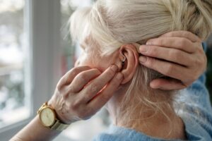 woman with hearing aid for single-sided deafness in Northern Virginia