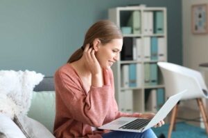 woman reading how to connect your hearing aids with smart devices